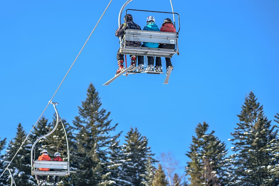 person riding on cable car, ride, blue, clouds, sky, snowboarding HD wallpaper