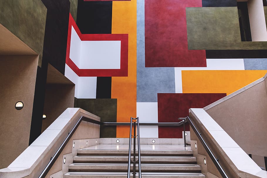 Staircase interior leading up to vibrant wall art in a building in London, HD wallpaper