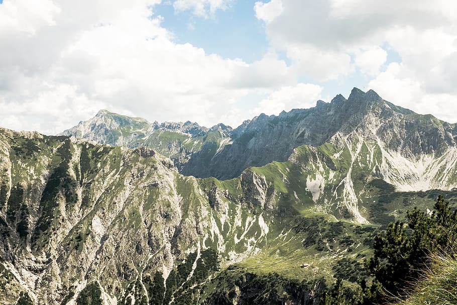 mountains covered with green grass under white cloudy sky, mountains under white clouds HD wallpaper