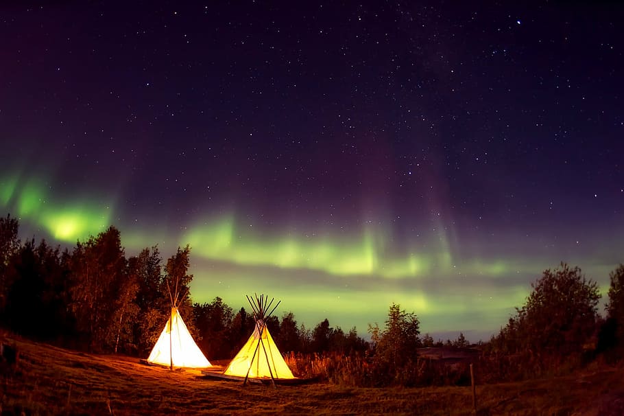 landscape view of aurora during night time, teepees, camp, campsite