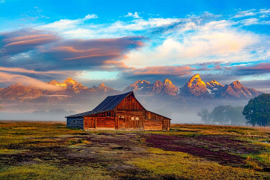 landscape photography of brown barn, brown house under blue sky HD wallpaper