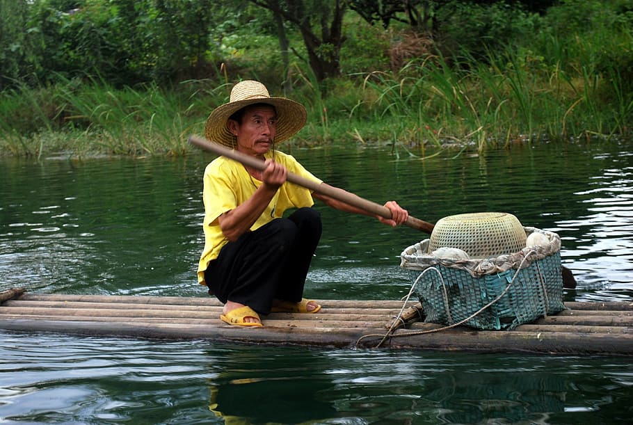 man sitting on raft while holding a bamboo stick, Fisherman HD wallpaper