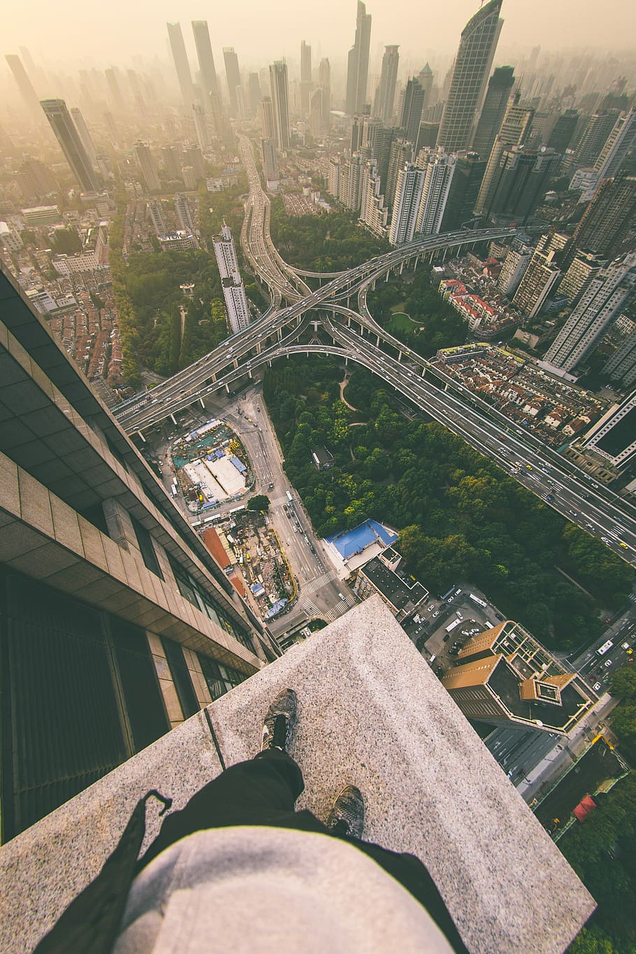 What Lies Below, person standing on building looking on city, HD wallpaper