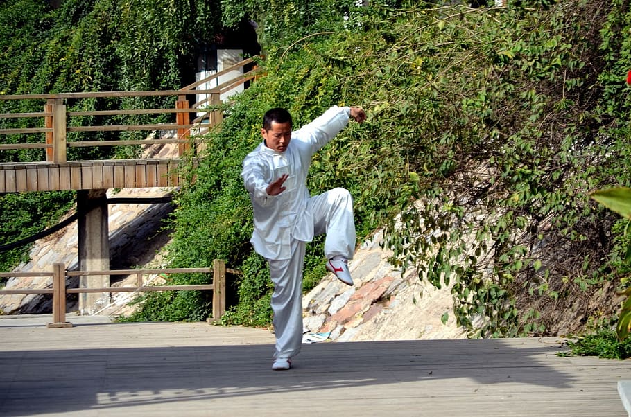 man wearing white suit doing karate, people, china, kung fu, gung fu