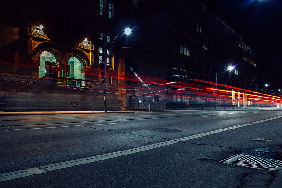 time-lapse photo of buildings beside road, timelapse photography of street lights