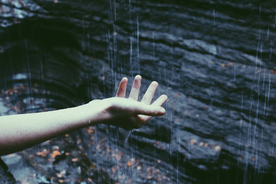 person catching rain drops, person touching the raindrops, hand HD wallpaper