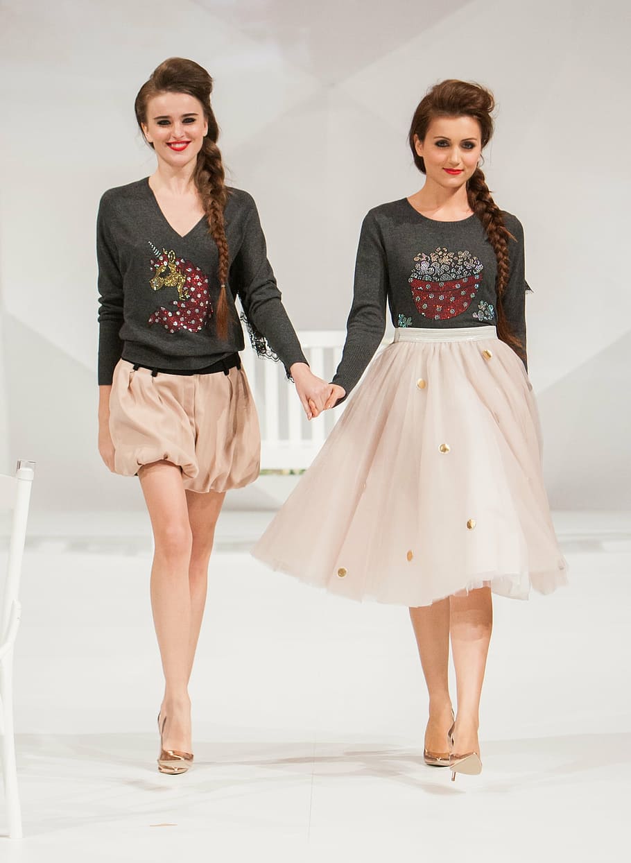 two women holding hands wearing dresses while walking, fashion show, HD wallpaper