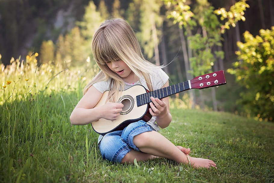 girl playing of beige guitar, person, human, child, blond, music