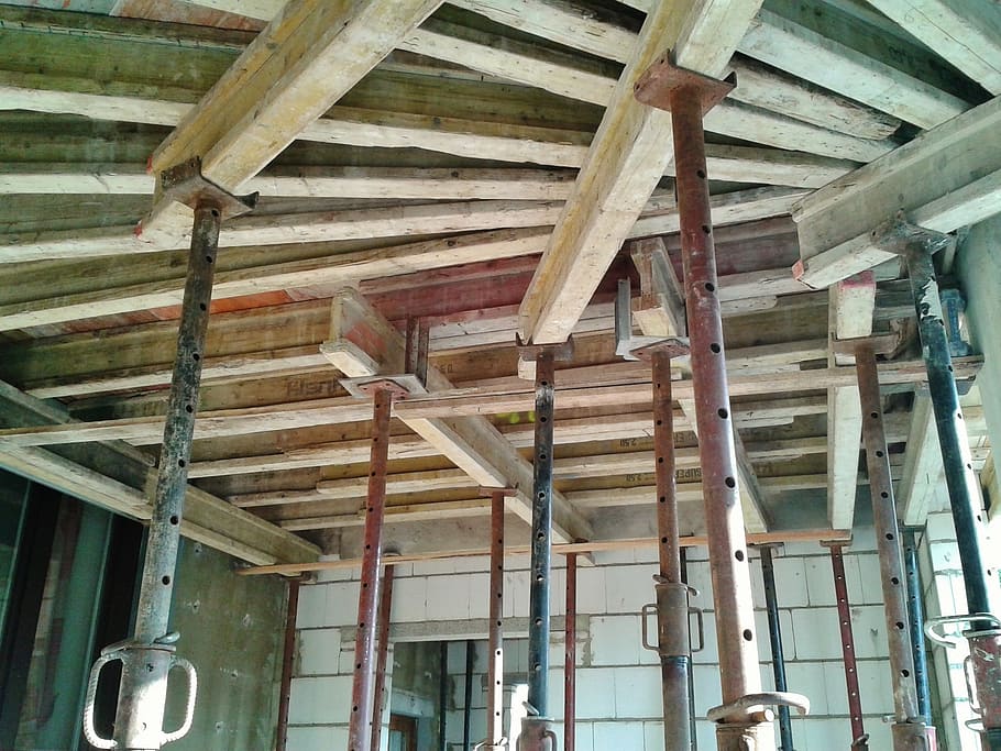 low angle-view of metal bars hanged on ceiling, house construction HD wallpaper