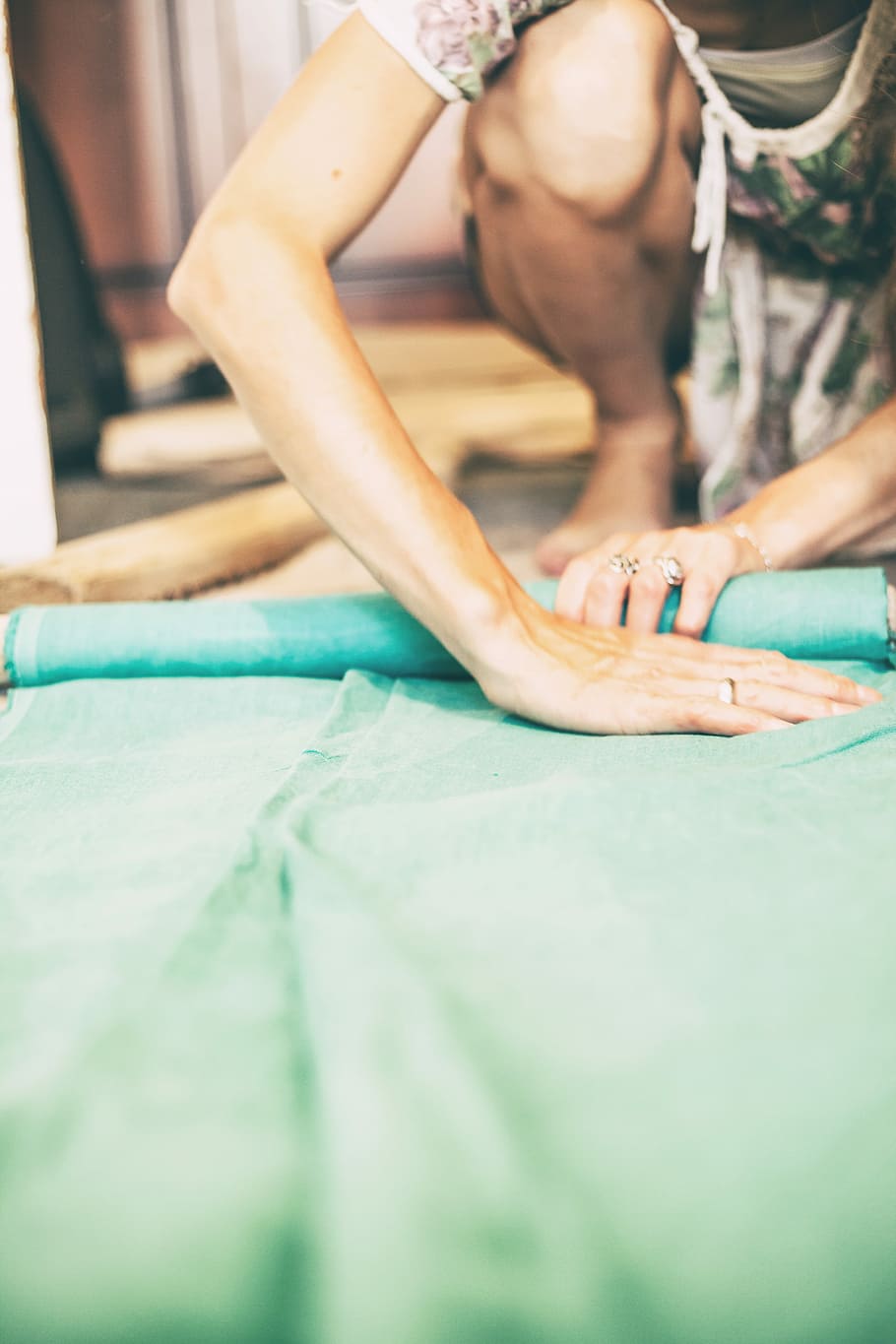 person folding green textile, hands, roll, fabric, woman, real people HD wallpaper
