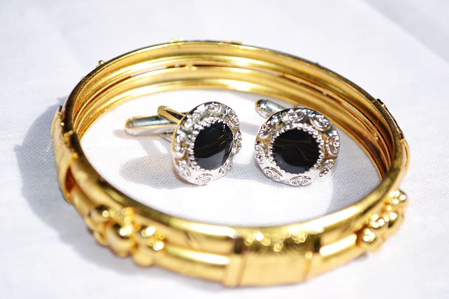 gold-colored ring with pair of silver-colored earrings, Bangles