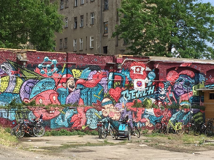 long-angle photography of graffiti wall by day, berlin, colors