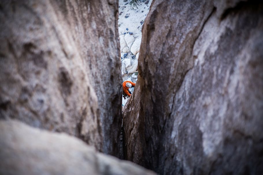 man climbing on rock, mountaineer, guy, adventure, rope, gear HD wallpaper