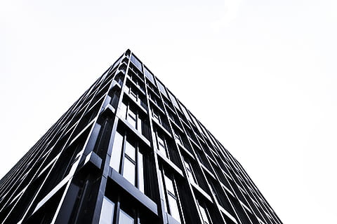black concrete building during daytime, black high-rise building HD wallpaper