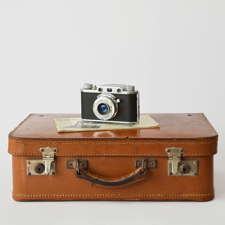 camera on leather bag, suitcase, brown, odl, retro styled, studio shot HD wallpaper
