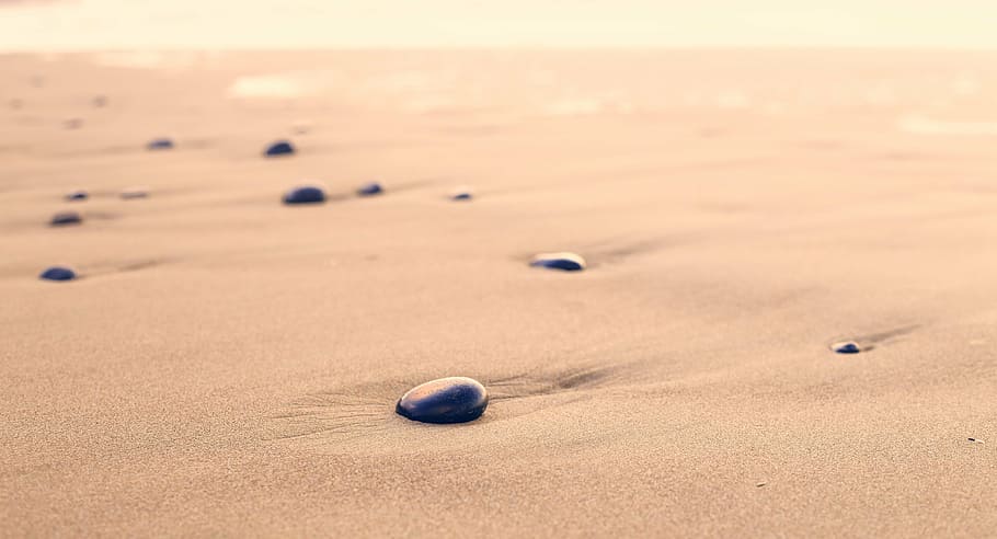 black pebbles on desert sand, beach, rounded, shape, stone HD wallpaper