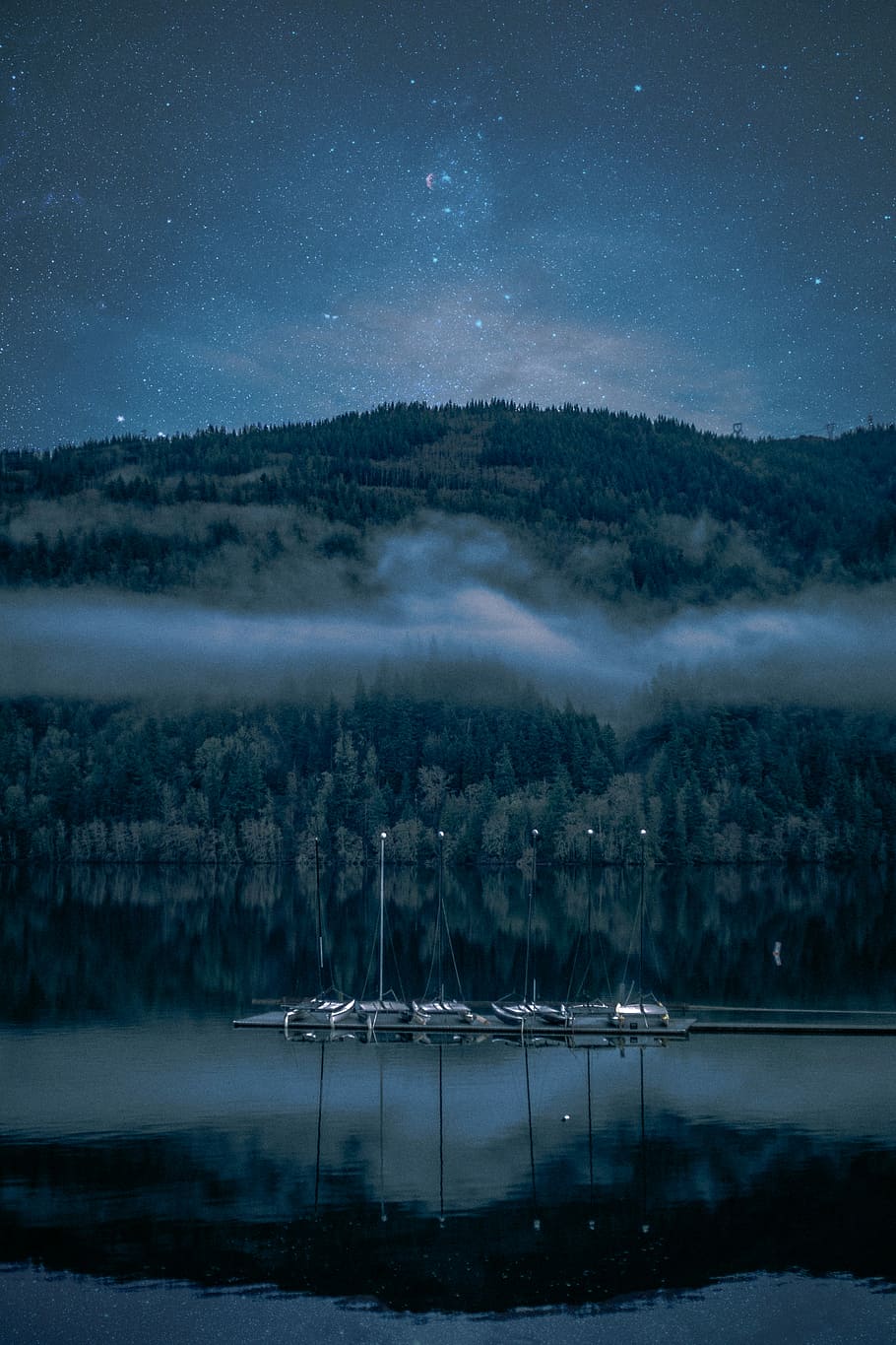 landscape photography of body of water surrounded by trees, boat near body of water HD wallpaper