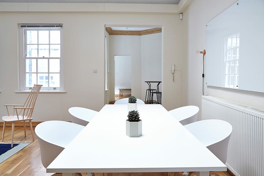White office space, rectangular white wooden table with four chairs dining set on floor HD wallpaper