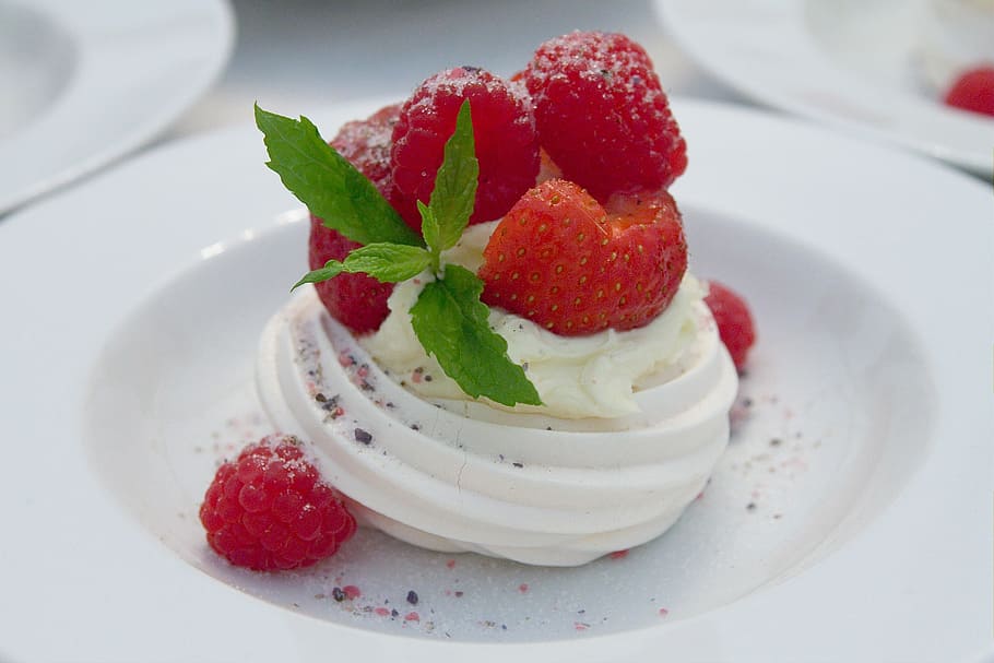 vanilla with strawberry and raspberry toppings on round white ceramic plate HD wallpaper