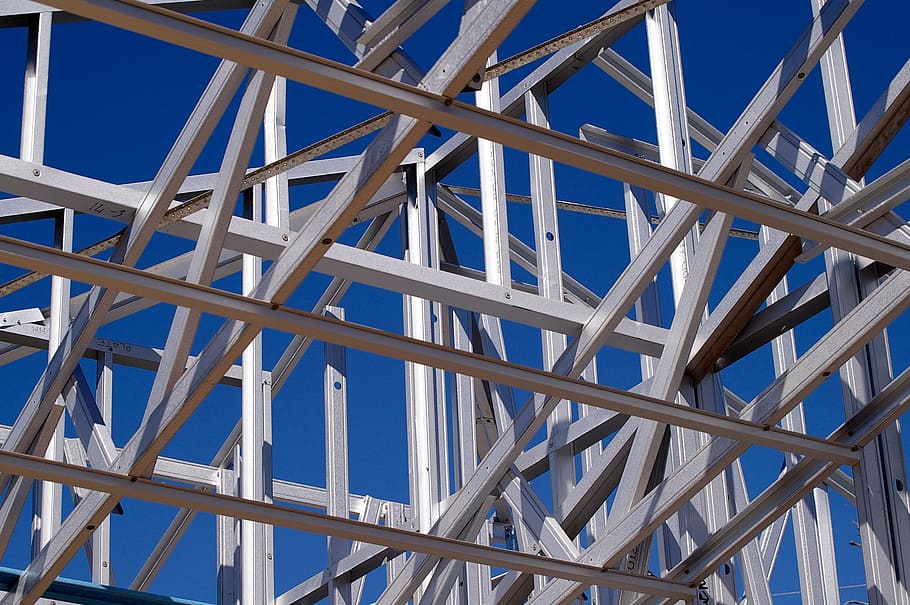 architectural photo of grey metal building frame under blue sky HD wallpaper