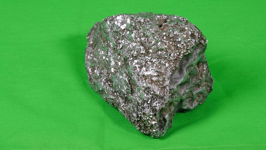 metallic, rock, shiny, colored background, studio shot, green background HD wallpaper