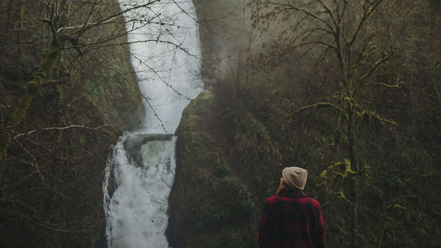 woman looking at the waterfalls, woman in red jacket facing waterfalls HD wallpaper