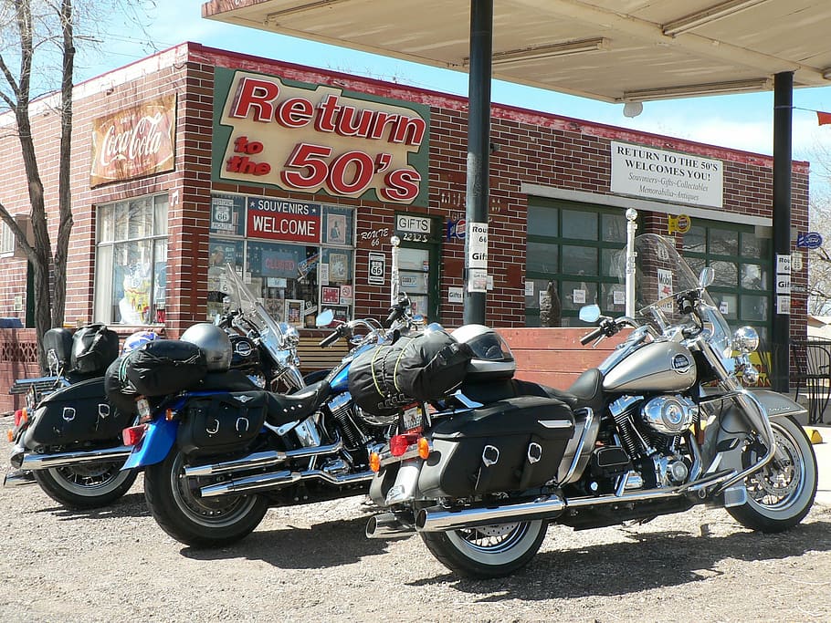 three touring motorcycles parked near Return to the 50's store HD wallpaper