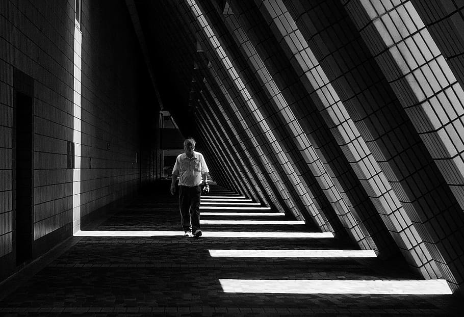 man walking inside the building, architecture, abstract, shadow HD wallpaper