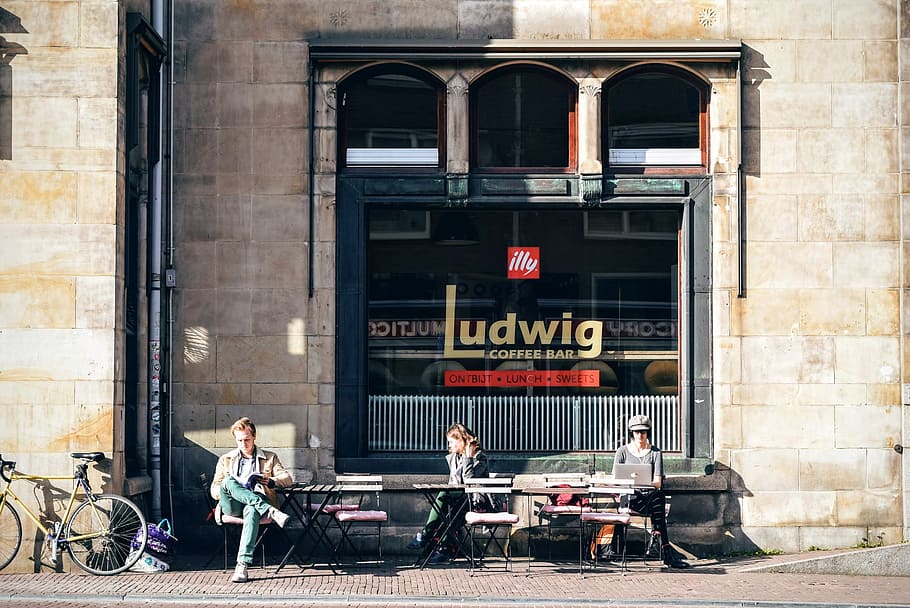 photo of three people sitting in front of Ludwig coffee, architecture, HD wallpaper
