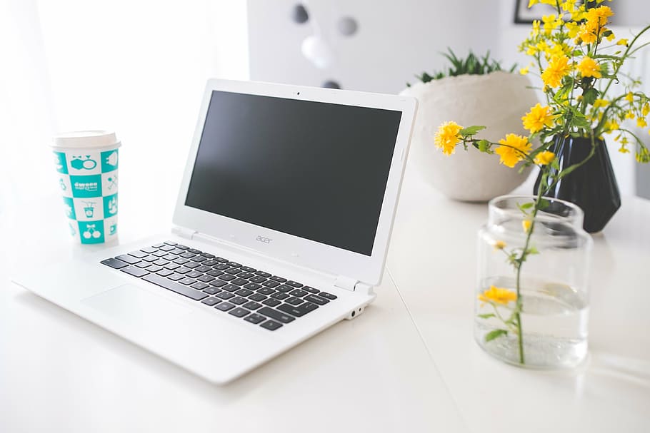 white Acer laptop beside vase of yellow cluster flower on white wooden table, HD wallpaper