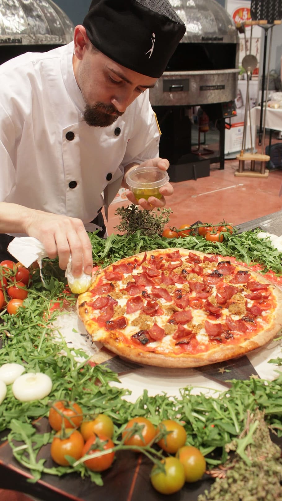 man putting toppings on pizza, chef, cook, uniform, food, pizzeria HD wallpaper