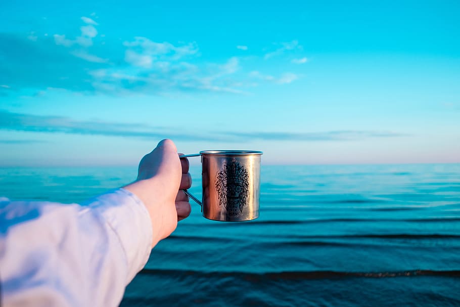 person holding stainless steel mug, sea, ocean, water, waves HD wallpaper