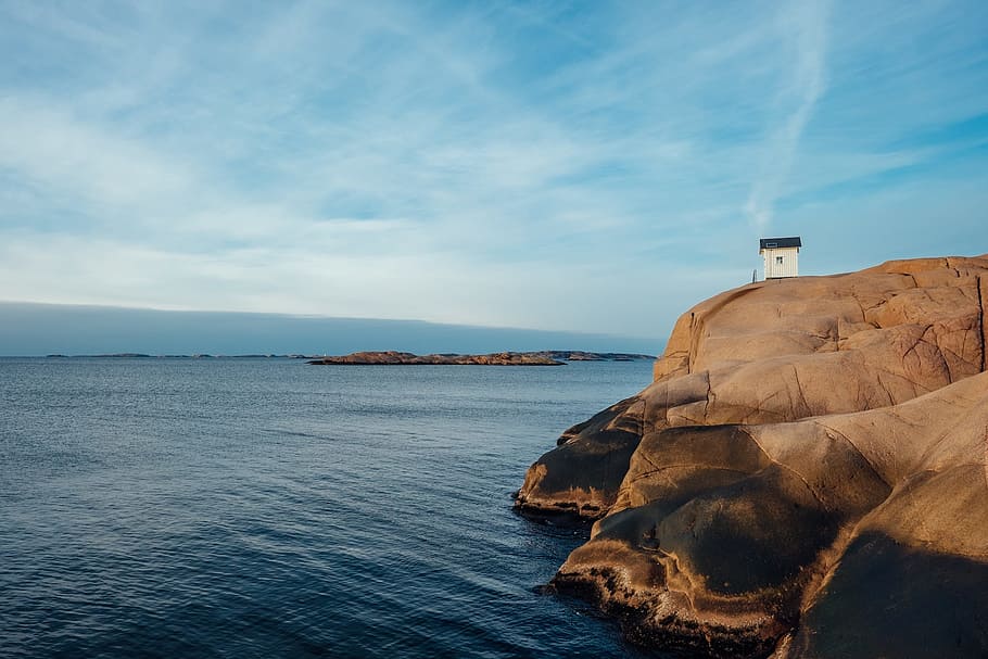 house on top of mountain near body of water, ocean, coast, rock HD wallpaper