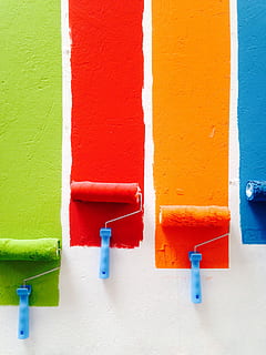 four orange, green, blue, and red paint rollers, four assorted paint rollers HD wallpaper