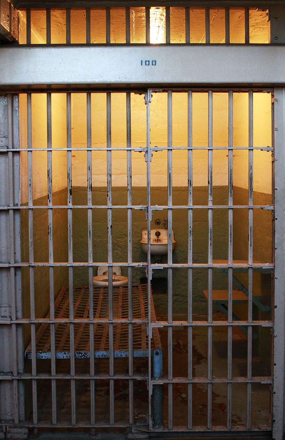 closed gray metal gate jail, cell, alcatraz prison, bars, behind bars