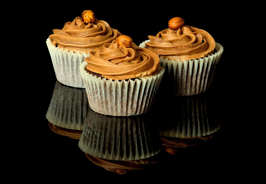 three cupcakes, sweets, sugar, chocolate, creme, candy, dough HD wallpaper