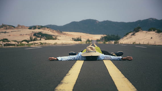 person lies on asphalt road, man, men, dom, young, caucasian HD wallpaper