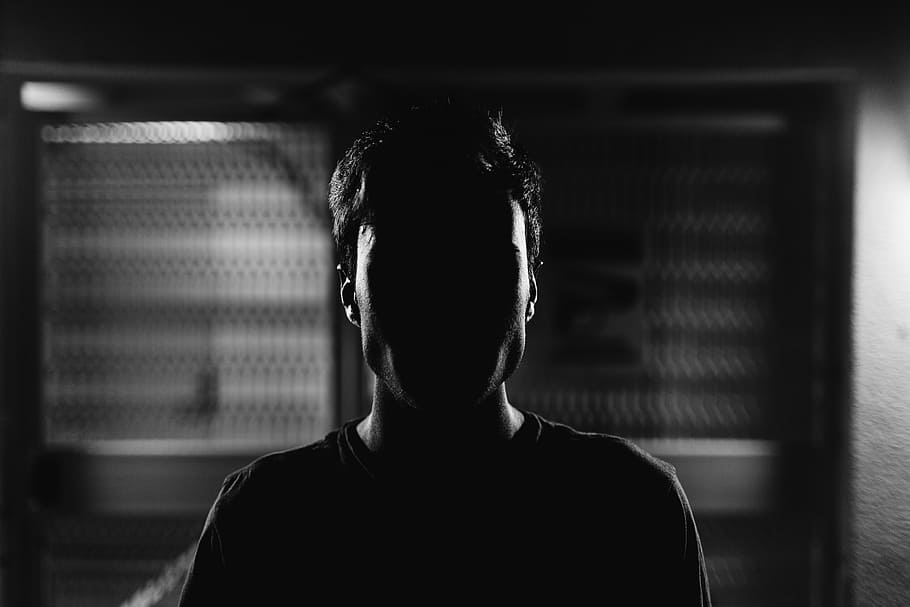 man's face grayscale photo, silhouette image of person standing