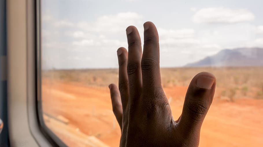 person holding vehicle glass in close-up photography, black HD wallpaper