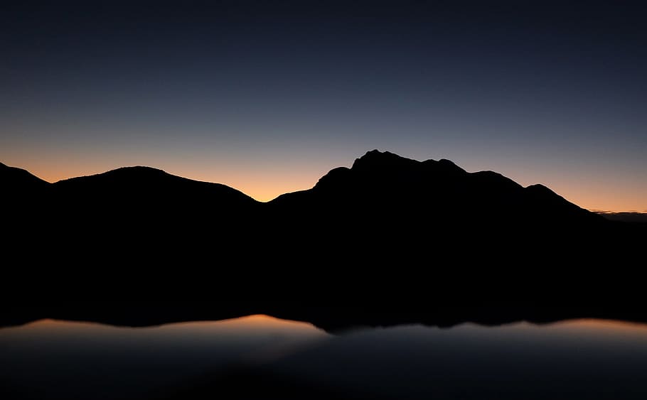 silhouette photography of mountain near body of water, silhouette of mountain with body of water reflection HD wallpaper