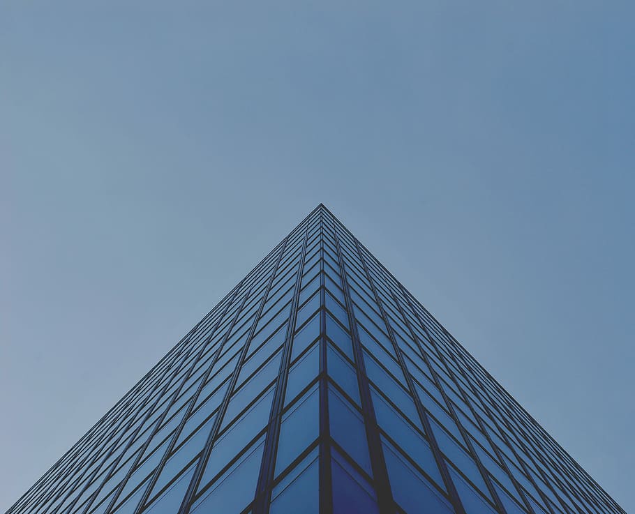 architectural photography of blue glass building, gray window curtain building at daytime in low angle shot HD wallpaper