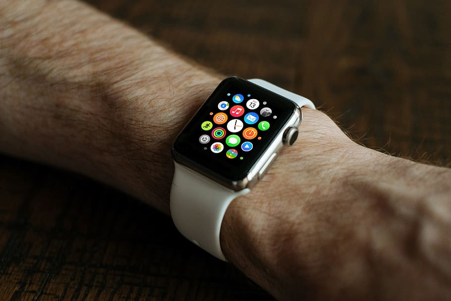 person wearing space gray Apple Watch with white sports band, HD wallpaper
