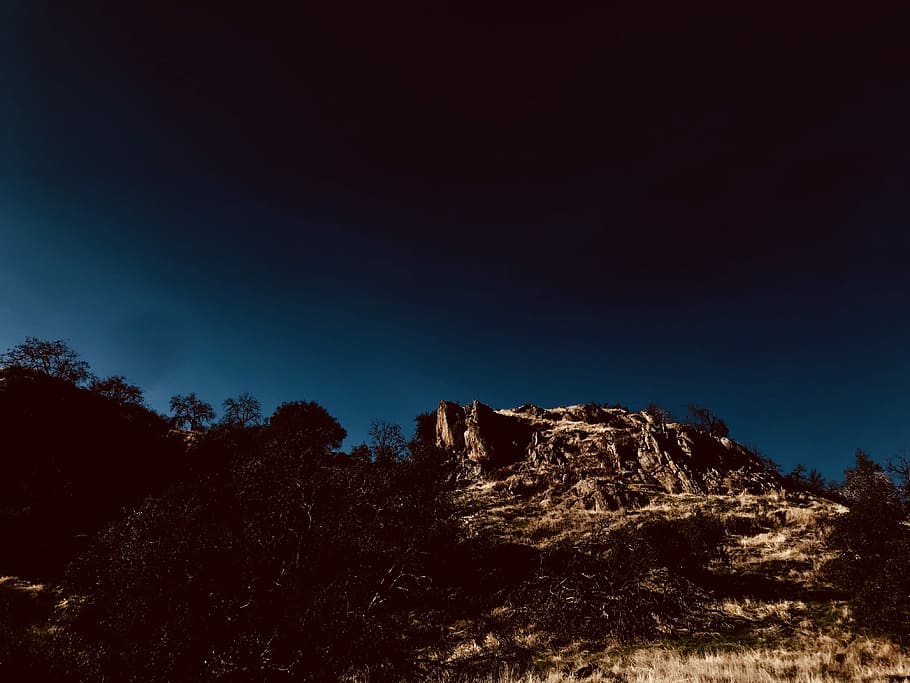 brown mountain under blue and black sky, rock, cliff, landscape HD wallpaper
