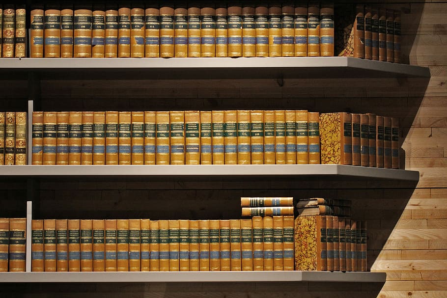 brown hardbound books, brown book collection on bookshelf, indoor HD wallpaper