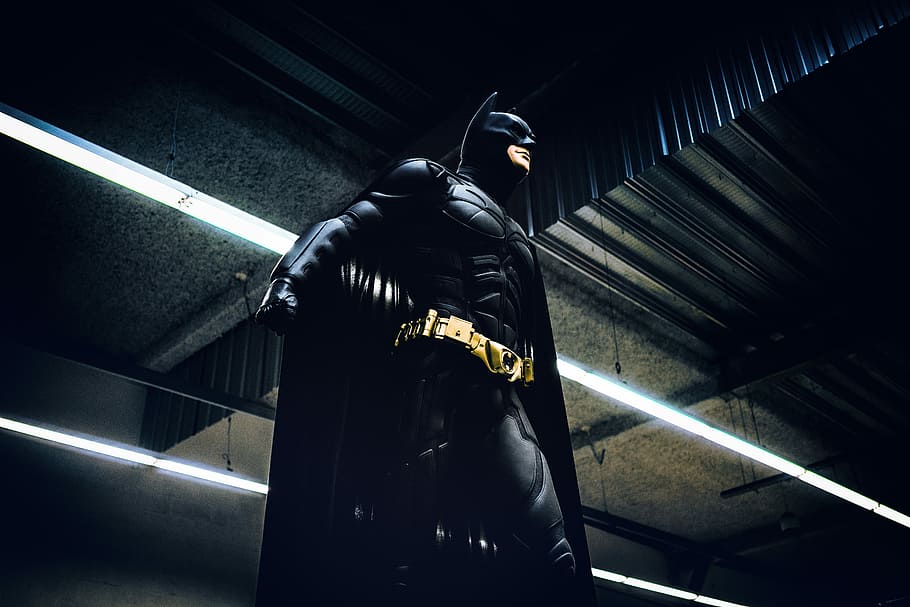 Batman standing under steel roof, Batman standing inside building