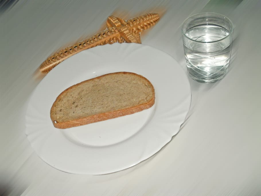 slice of bread on ceramic saucer beside drinking glass, fast HD wallpaper