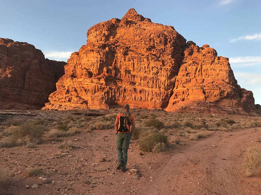 Person Wearing Orange Shirt and Green Pants, arid, backpack, barren HD wallpaper