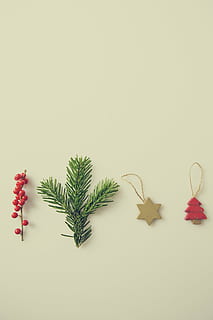 four assorted-color Christmas tree hanging decors on white surface HD wallpaper