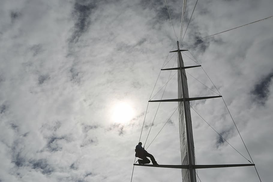person sitting on bridge frame during daytime, mast, sailboat HD wallpaper