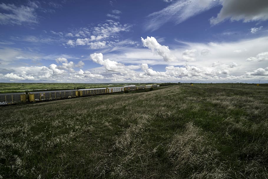 Train and landscape under the Beautiful Skies in Saskachewan HD wallpaper